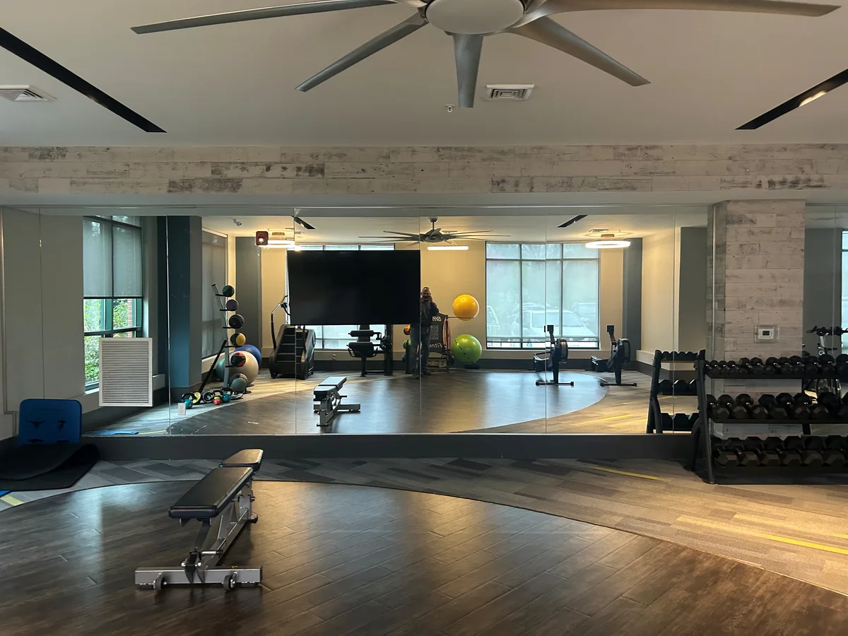 Large wall mirror in a home gym.